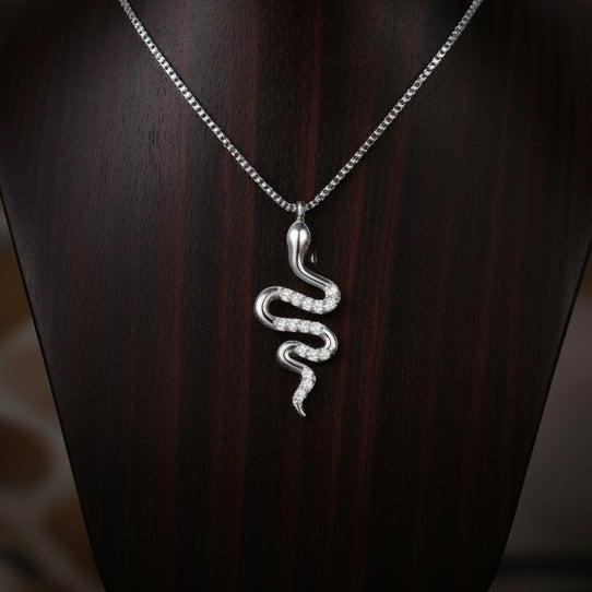reptile jewellery. snake necklace on wooden stand